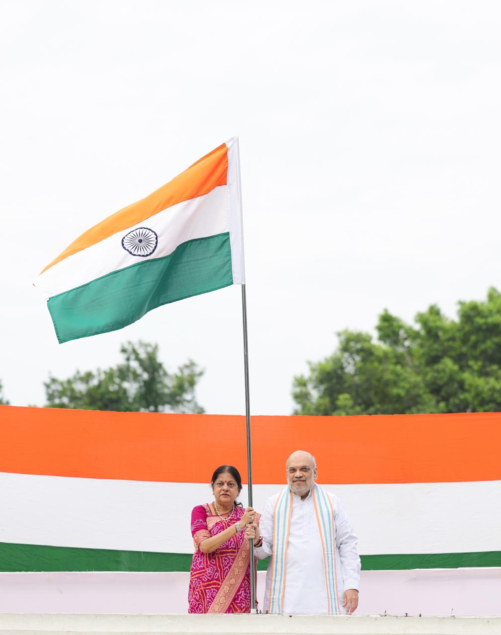 Union Home Minister Shri Amit Shah hoists Tiranga at his residence in New Delhi, under #HarGharTiranga campaign.